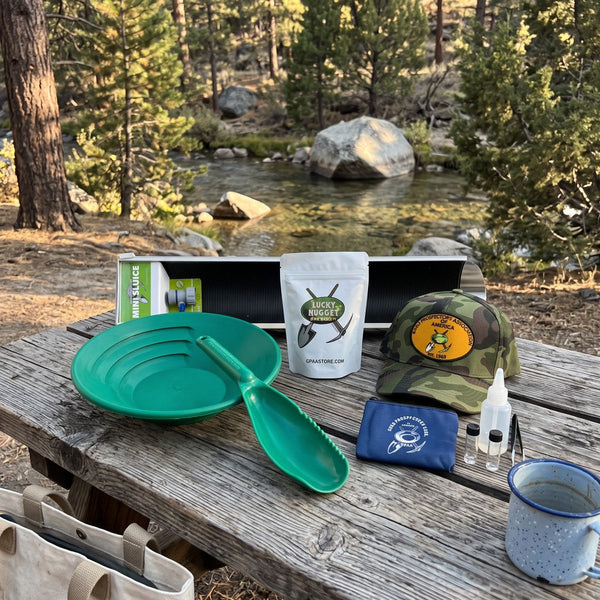 GPAA prospecting starter kit laid out on a creekside picnic table